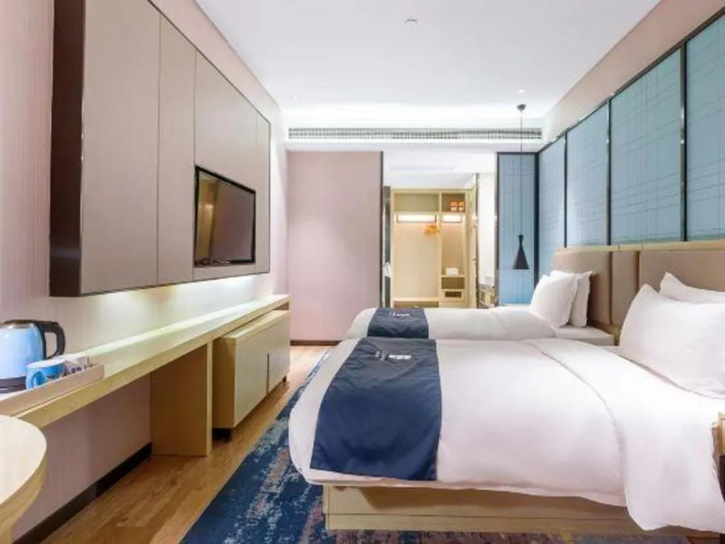Bed in Echarm Hotel Nanjing Jiangning Tianyin Avenue Metro Station