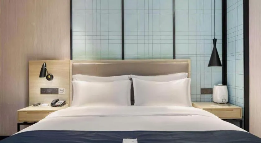 Bed in Echarm Hotel Nanjing Jiangning Tianyin Avenue Metro Station