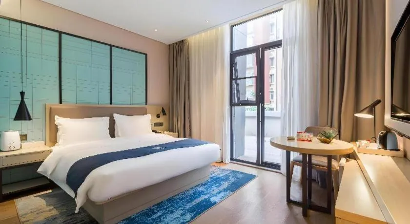 Bed in Echarm Hotel Nanjing Jiangning Tianyin Avenue Metro Station