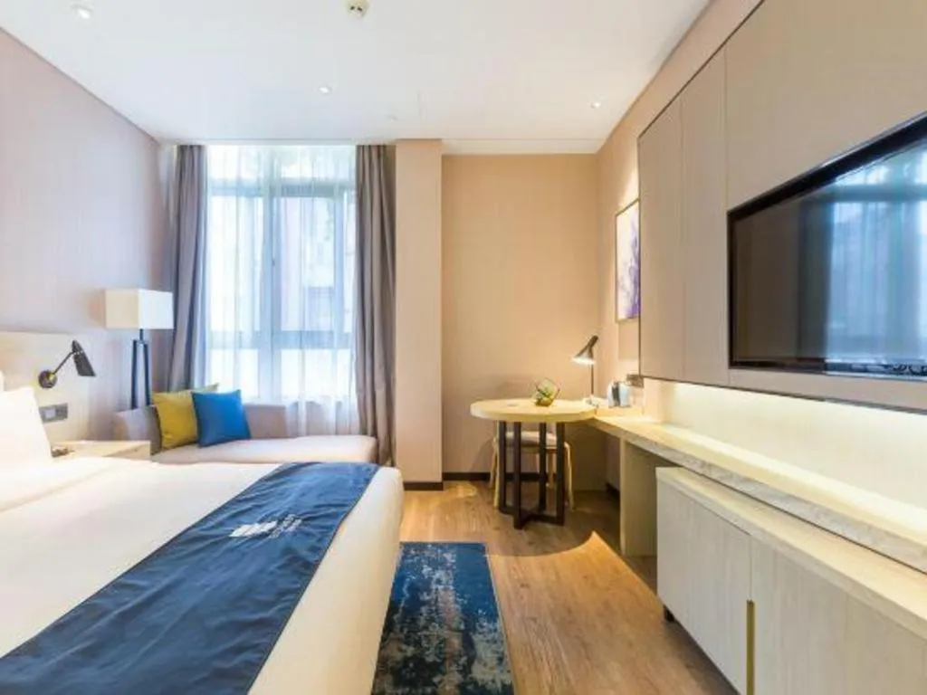 Bed in Echarm Hotel Nanjing Jiangning Tianyin Avenue Metro Station