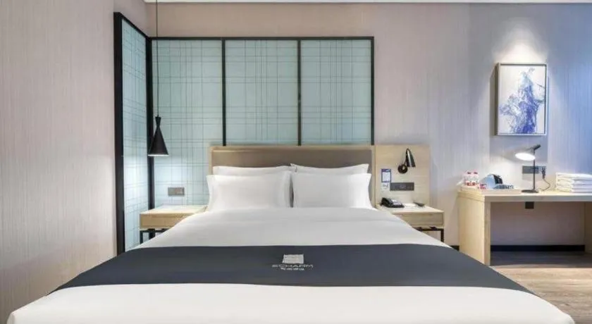 Bed in Echarm Hotel Nanjing Jiangning Tianyin Avenue Metro Station