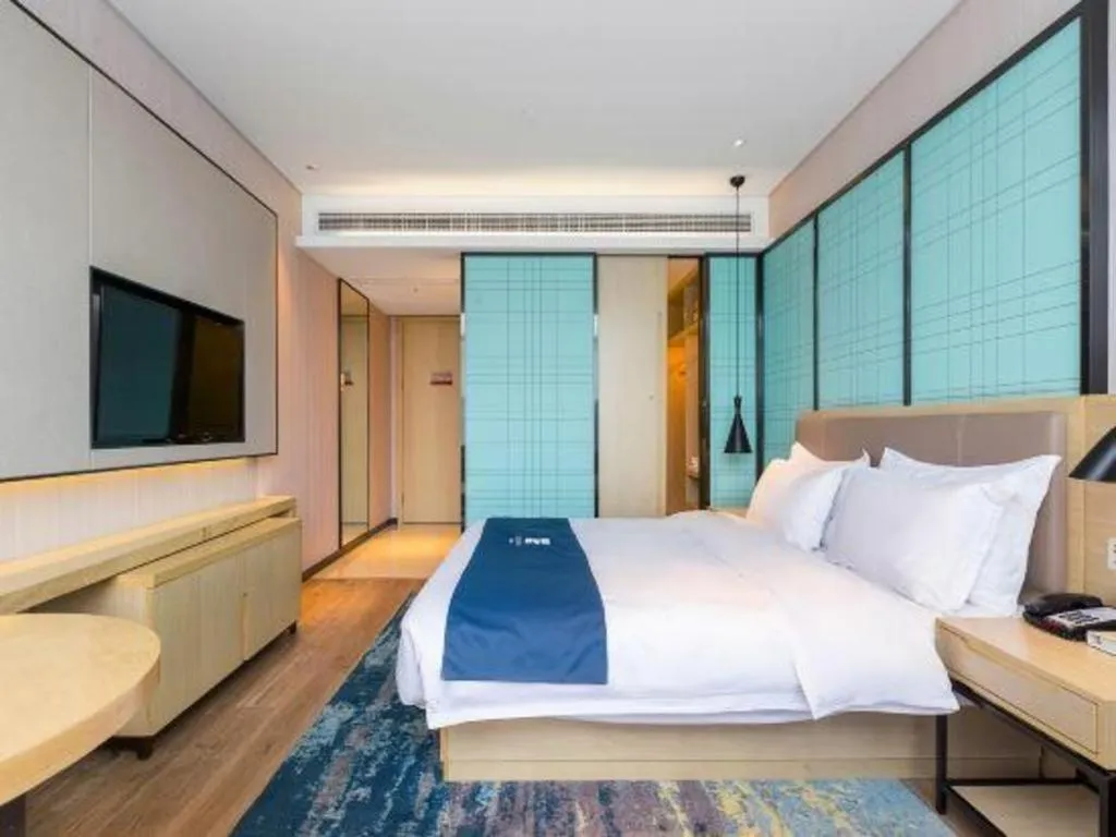 Bed in Echarm Hotel Nanjing Jiangning Tianyin Avenue Metro Station