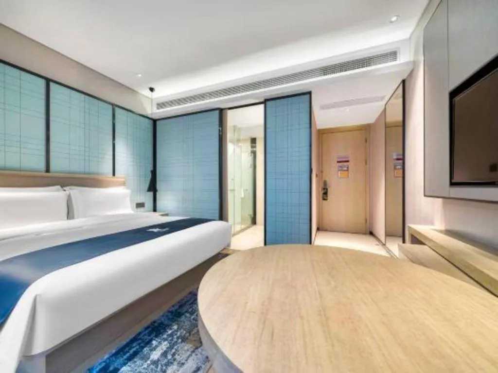 Bed in Echarm Hotel Nanjing Jiangning Tianyin Avenue Metro Station