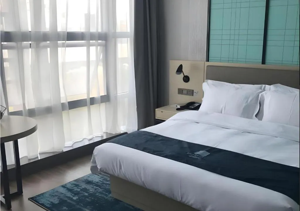 Bed in Echarm Hotel Nanjing Jiangning Tianyin Avenue Metro Station