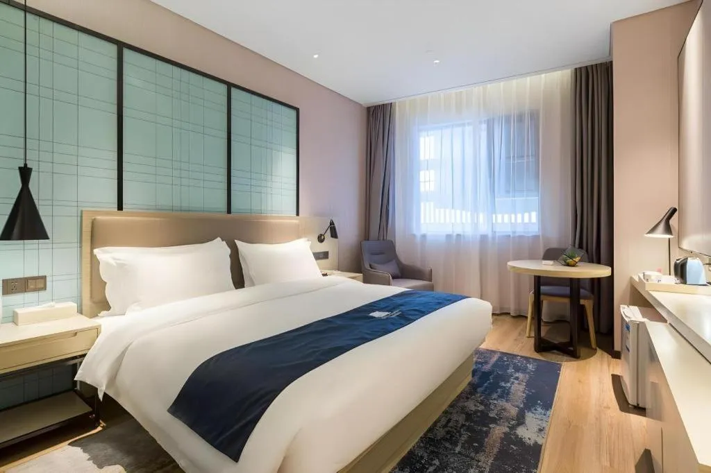 Bed in Echarm Hotel Nanjing Jiangning Tianyin Avenue Metro Station