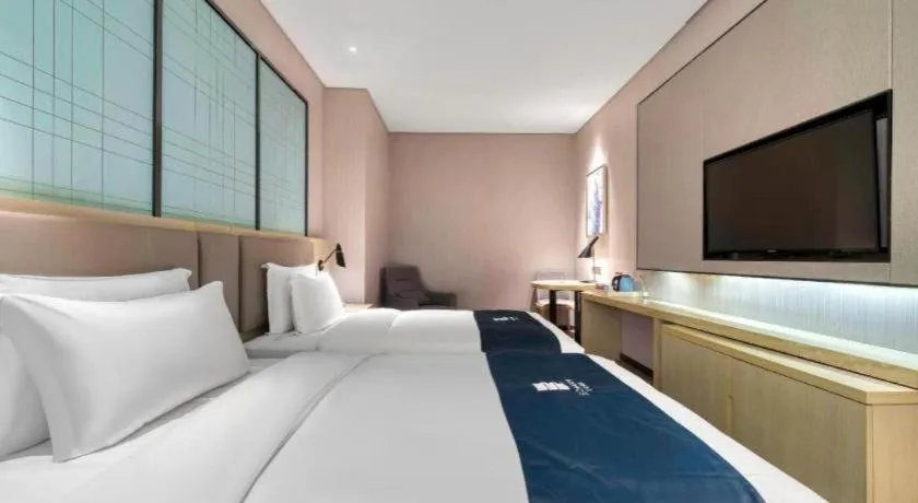 Bed in Echarm Hotel Nanjing Jiangning Tianyin Avenue Metro Station