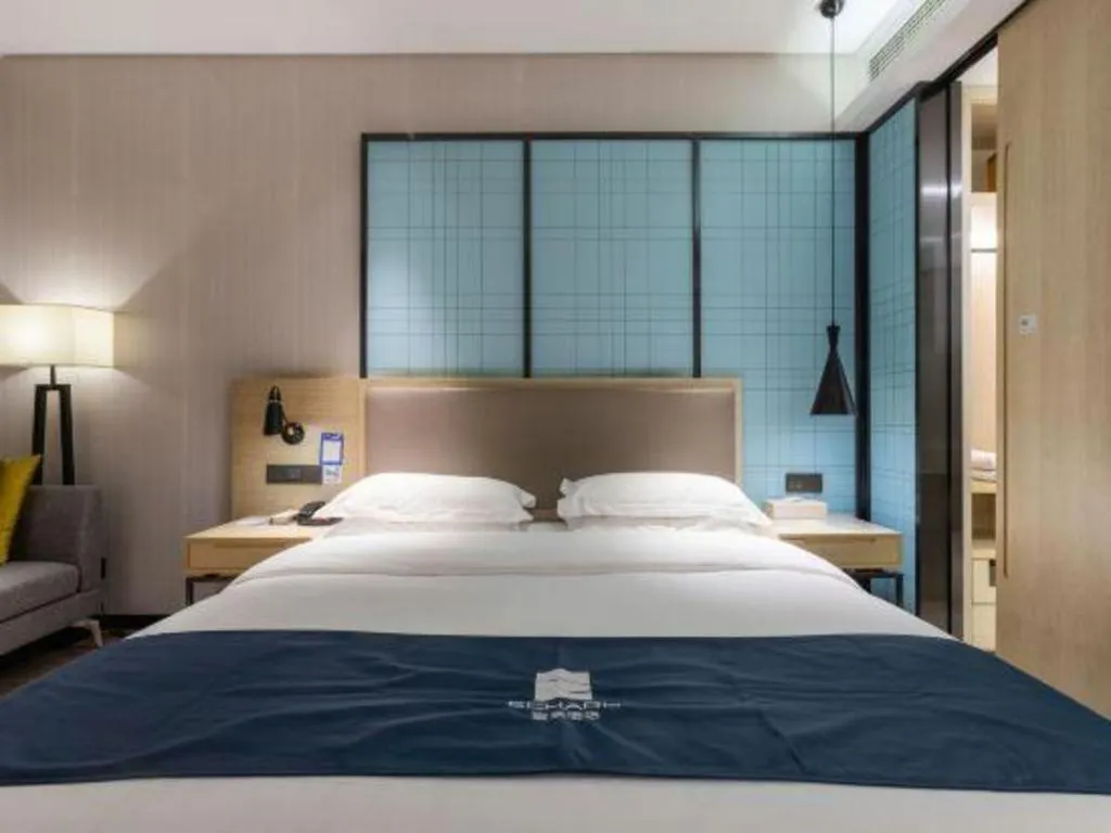 Bed in Echarm Hotel Nanjing Jiangning Tianyin Avenue Metro Station