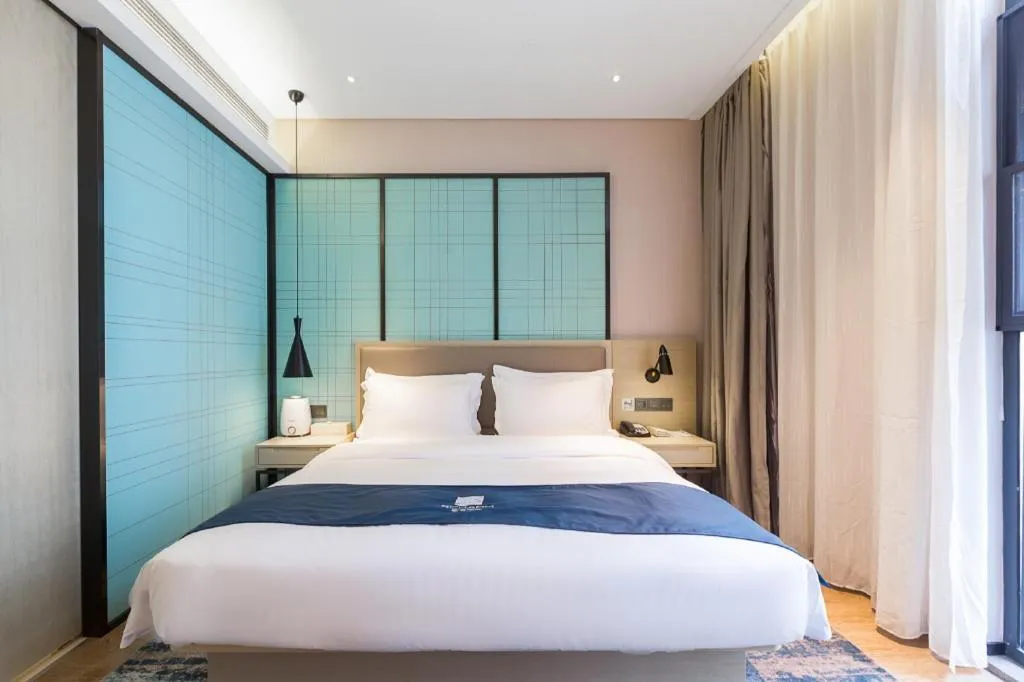 Bed in Echarm Hotel Nanjing Jiangning Tianyin Avenue Metro Station