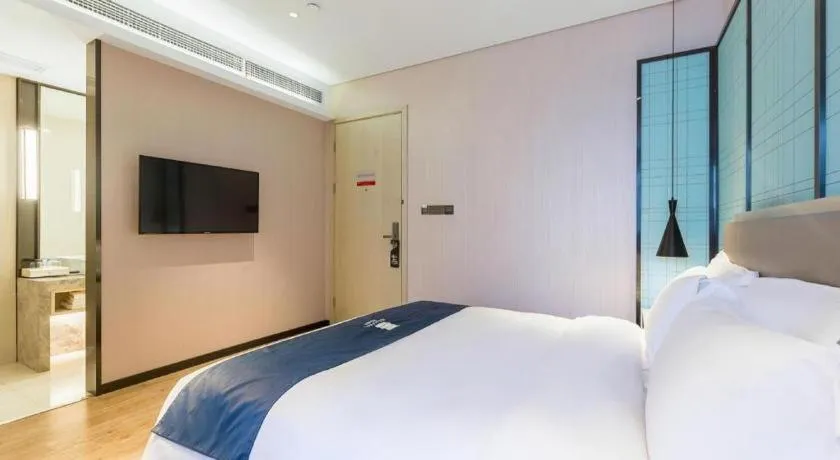 Bed in Echarm Hotel Nanjing Jiangning Tianyin Avenue Metro Station