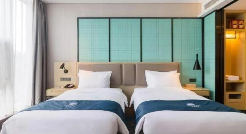 Bed in Echarm Hotel Nanjing Jiangning Tianyin Avenue Metro Station