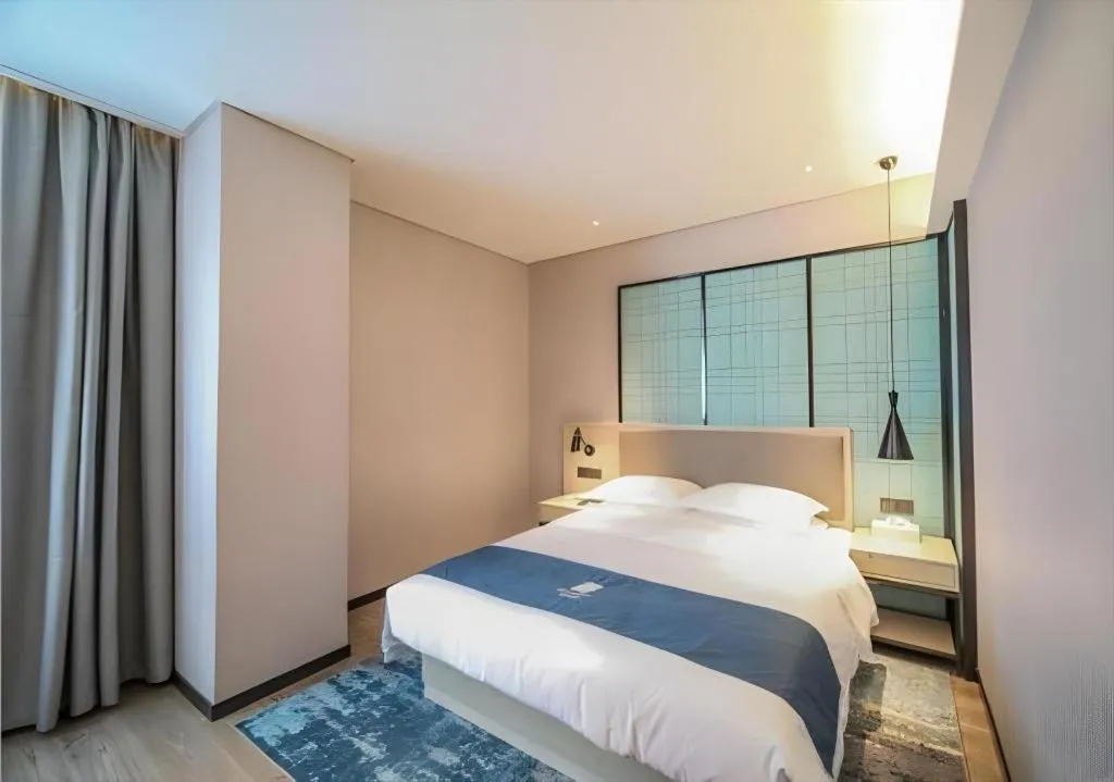 Bed in Echarm Hotel Nanjing Jiangning Tianyin Avenue Metro Station