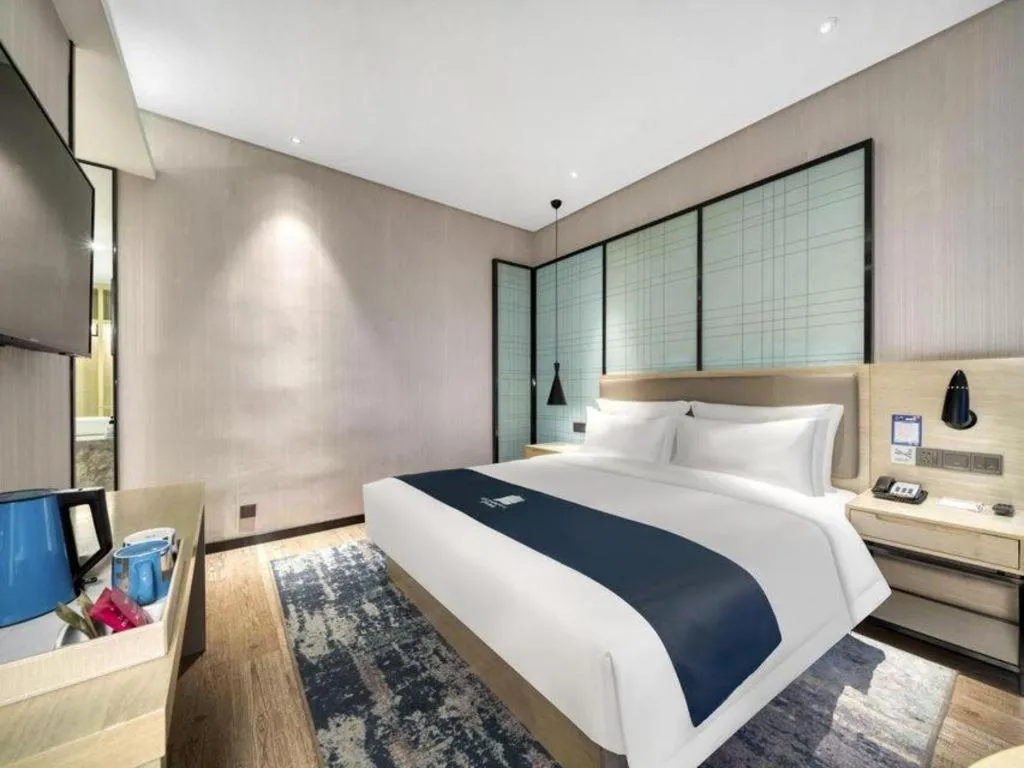 Bed in Echarm Hotel Nanjing Jiangning Tianyin Avenue Metro Station