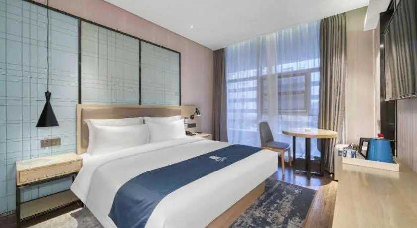Bed in Echarm Hotel Nanjing Jiangning Tianyin Avenue Metro Station