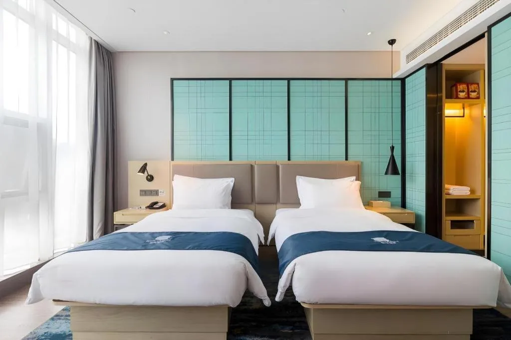 Bed in Echarm Hotel Nanjing Jiangning Tianyin Avenue Metro Station