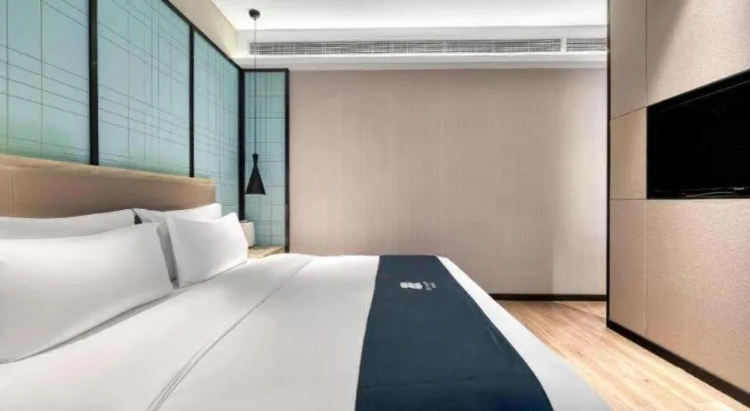 Bed in Echarm Hotel Nanjing Jiangning Tianyin Avenue Metro Station