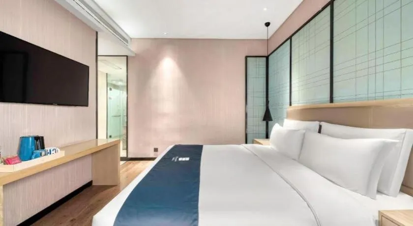 Bed in Echarm Hotel Nanjing Jiangning Tianyin Avenue Metro Station