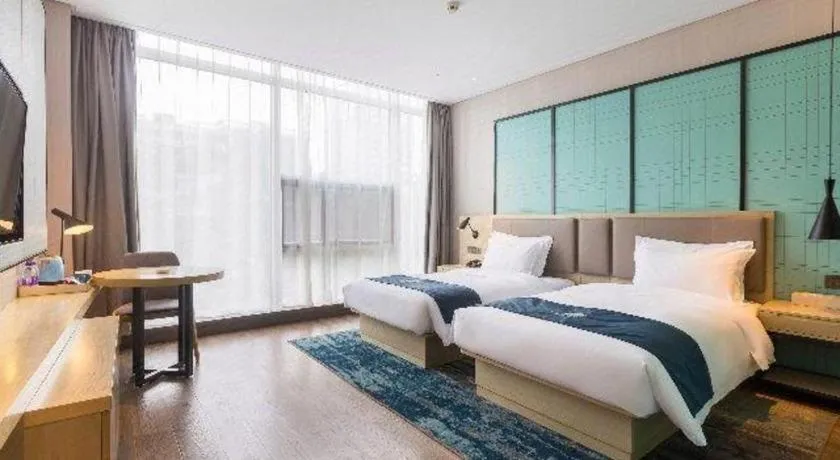 Bed in Echarm Hotel Nanjing Jiangning Tianyin Avenue Metro Station