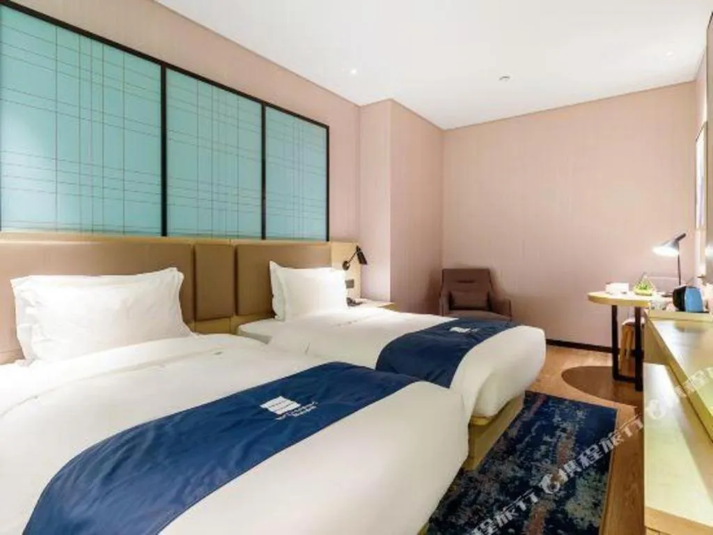 Bed in Echarm Hotel Nanjing Jiangning Tianyin Avenue Metro Station