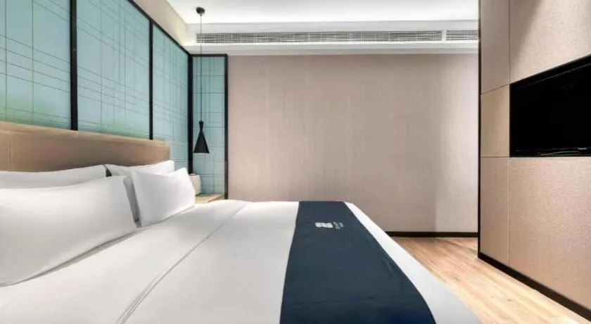 Bed in Echarm Hotel Nanjing Jiangning Tianyin Avenue Metro Station