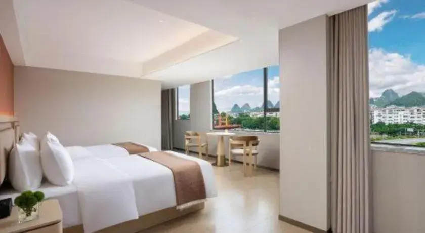 Bed in Immersing Hotel Guilin Two Rivers and Four Lakes Dongxi Alley Bed in Immersing Hotel Guilin Two Rivers and Four Lakes Dongxi Alley