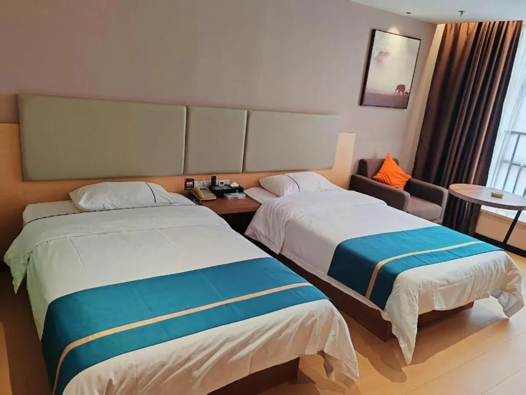 Bed in JTOUR Inn Maoming Gaozhou Guabangling Park