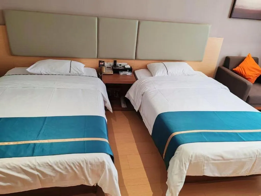 Bed in JTOUR Inn Maoming Gaozhou Guabangling Park
