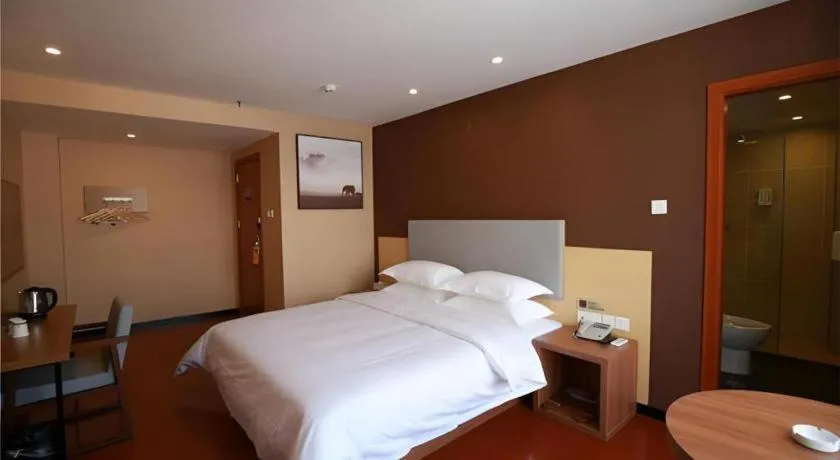 Bed in JTOUR Inn Maoming Gaozhou Guabangling Park
