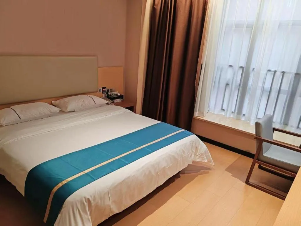 Bed in JTOUR Inn Maoming Gaozhou Guabangling Park