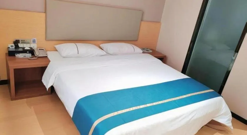 Bed in JTOUR Inn Maoming Gaozhou Guabangling Park
