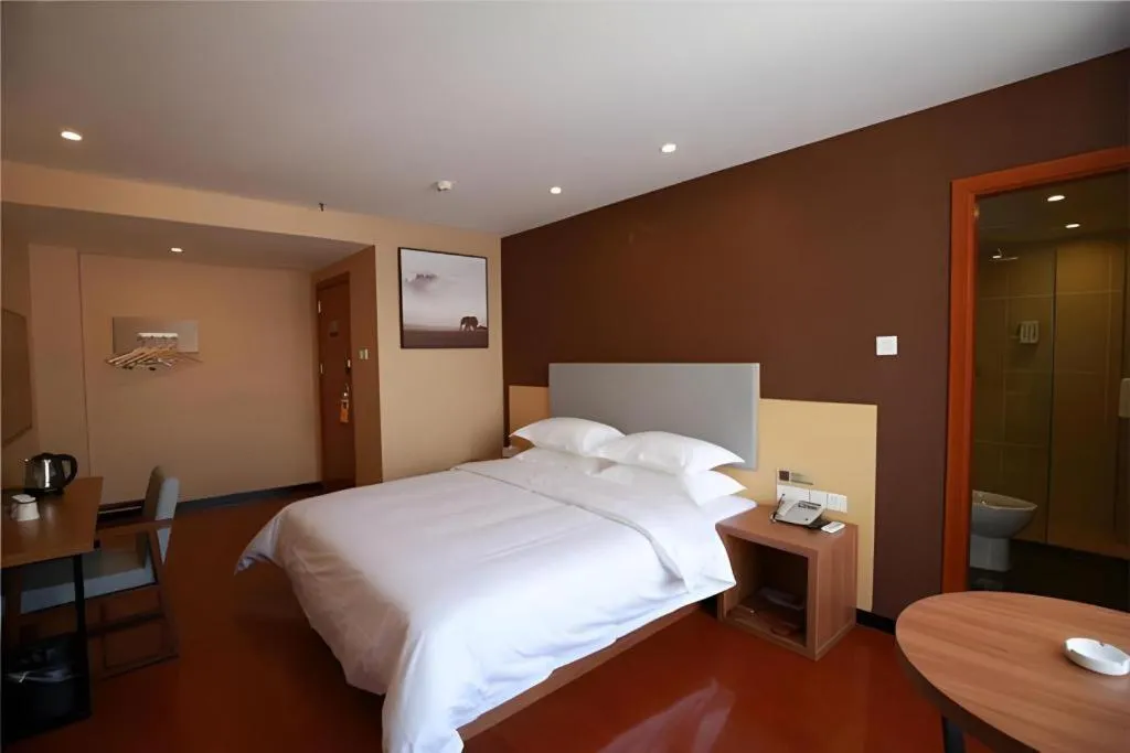 Bed in JTOUR Inn Maoming Gaozhou Guabangling Park