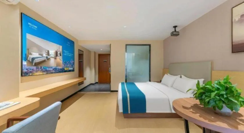 Bed in JTOUR Inn Maoming Gaozhou Guabangling Park