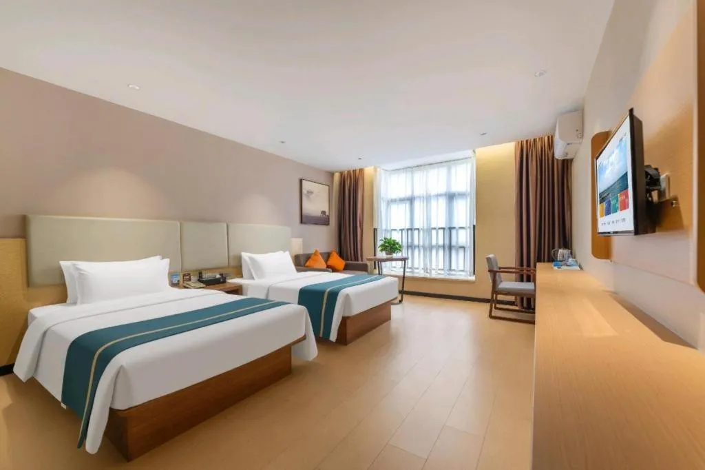 Bed in JTOUR Inn Maoming Gaozhou Guabangling Park