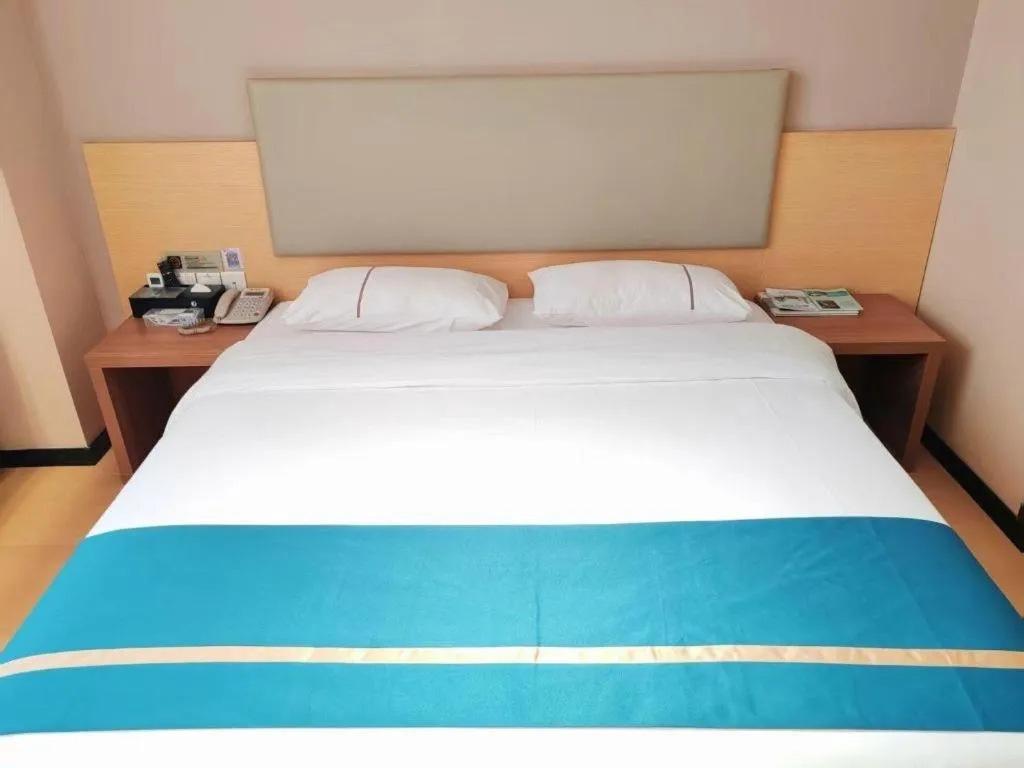 Bed in JTOUR Inn Maoming Gaozhou Guabangling Park