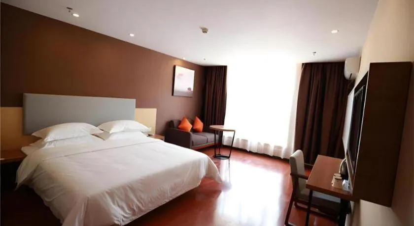 Bed in JTOUR Inn Maoming Gaozhou Guabangling Park
