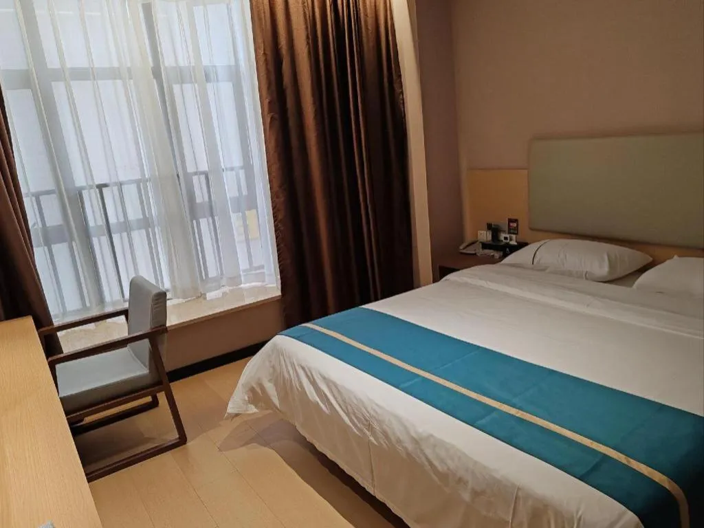 Bed in JTOUR Inn Maoming Gaozhou Guabangling Park
