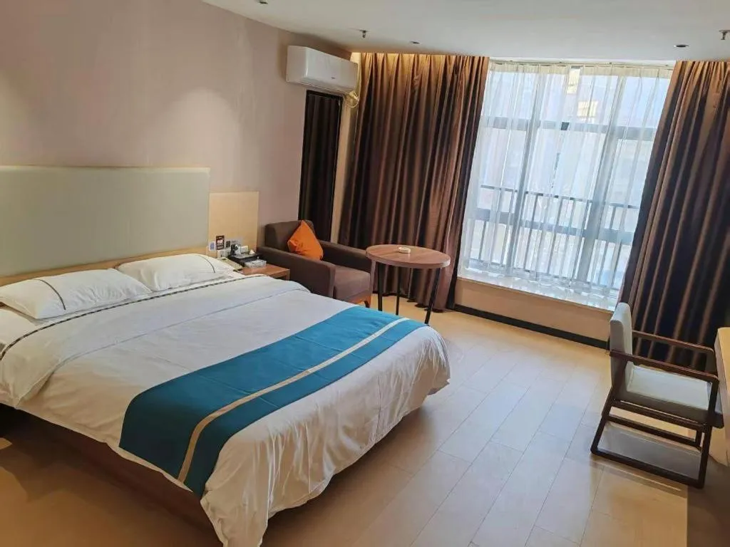 Bed in JTOUR Inn Maoming Gaozhou Guabangling Park