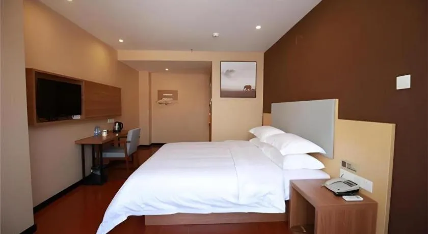 Bed in JTOUR Inn Maoming Gaozhou Guabangling Park