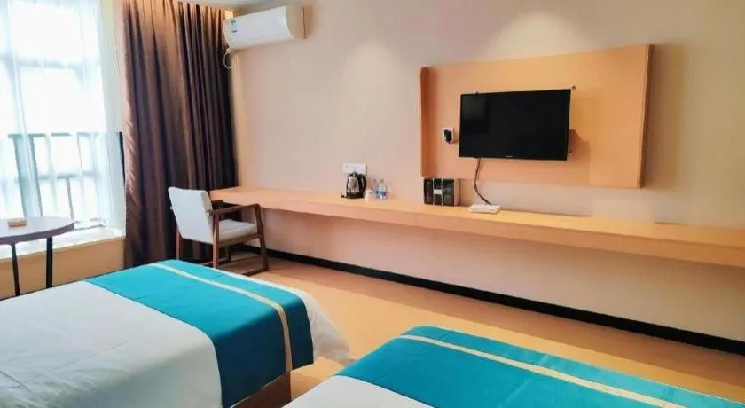Bed in JTOUR Inn Maoming Gaozhou Guabangling Park