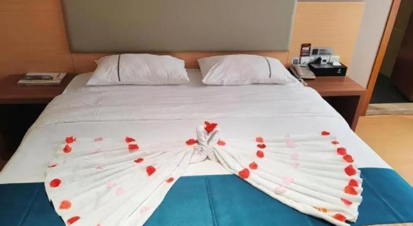 Bed in JTOUR Inn Maoming Gaozhou Guabangling Park
