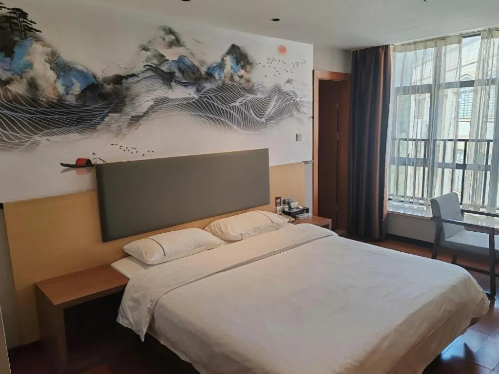 Bed in JTOUR Inn Maoming Gaozhou Guabangling Park