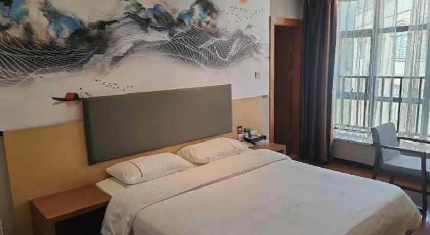 Bed in JTOUR Inn Maoming Gaozhou Guabangling Park