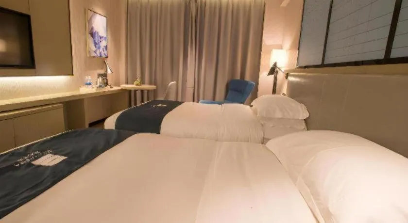 Bed in Echarm Hotel Wuhan Vanke Future Center Wulidun Metro Station