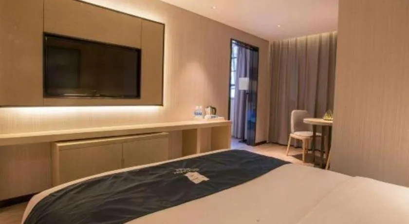 Bed in Echarm Hotel Wuhan Vanke Future Center Wulidun Metro Station