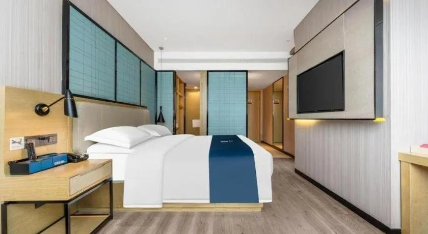 Bed in Echarm Hotel Wuhan Vanke Future Center Wulidun Metro Station