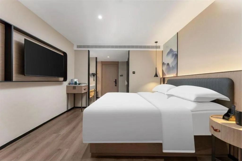 Bed in Echarm Hotel Wuhan Vanke Future Center Wulidun Metro Station