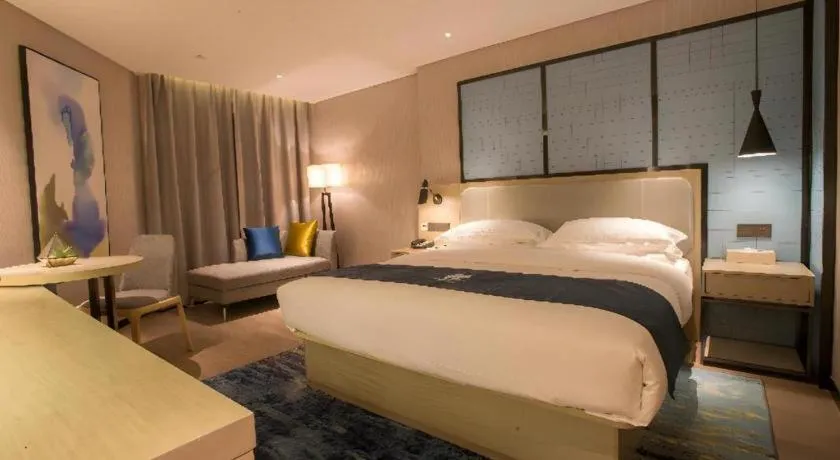 Bed in Echarm Hotel Wuhan Vanke Future Center Wulidun Metro Station