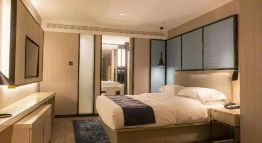 Bed in Echarm Hotel Wuhan Vanke Future Center Wulidun Metro Station