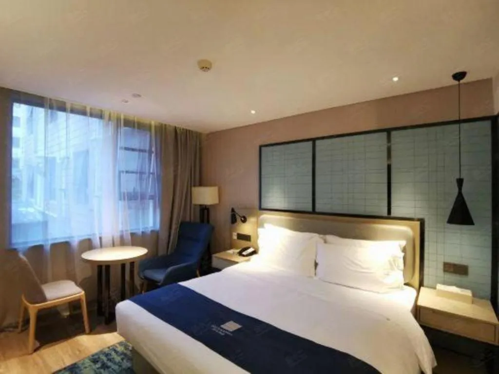 Bed in Echarm Hotel Wuhan Vanke Future Center Wulidun Metro Station