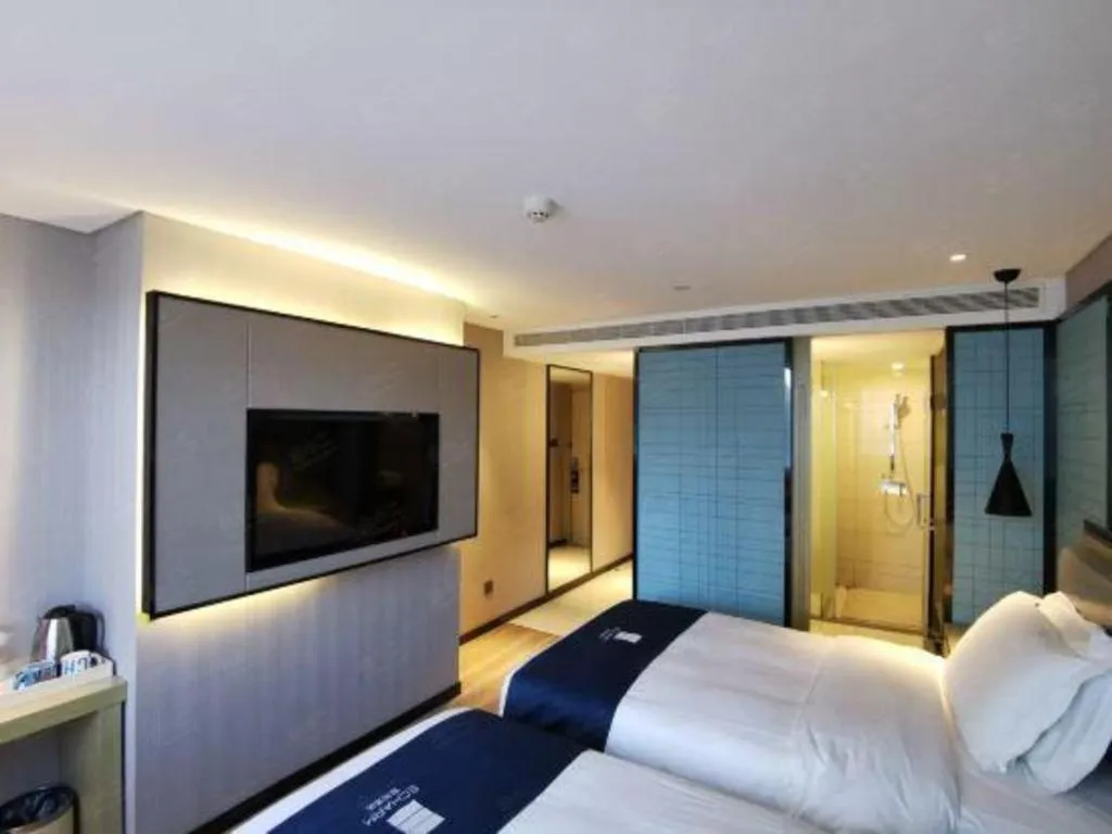 Bed in Echarm Hotel Wuhan Vanke Future Center Wulidun Metro Station