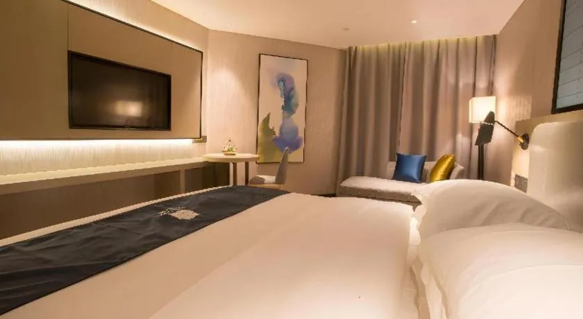 Bed in Echarm Hotel Wuhan Vanke Future Center Wulidun Metro Station